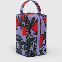 Rectangular Baggu Dopp Kit bag with red apple pattern on a purple background