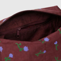 close up shop of a baggu dopp kit showing the zippered inside pocket detail