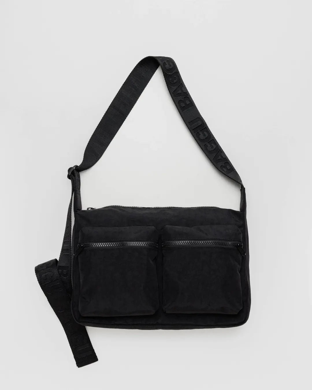 Black Baggu medium cargo crossbody bag with multiple pockets on a light gray background