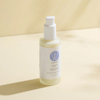 Bottle of Wildcraft Calm Face Lotion on a beige background