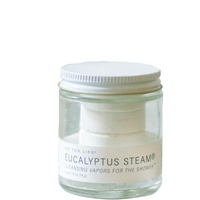 A clear jar labeled 'Eucalyptus Steam - Cleansing Vapors for the Shower' by No Tox Life, containing white eucalyptus steam tablets for shower use.