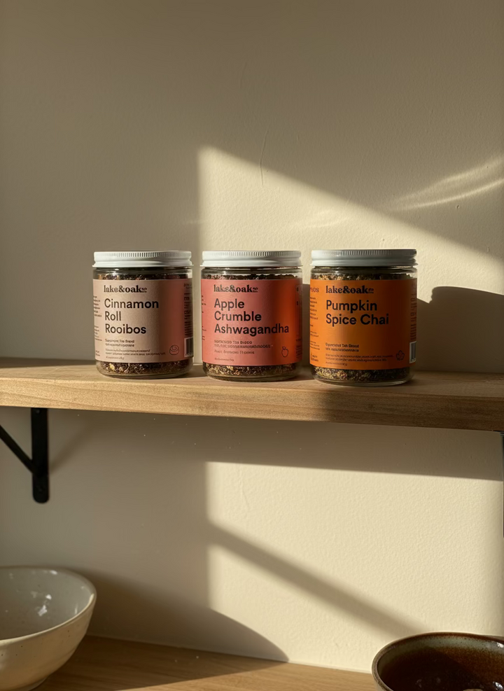 Three jars of tea from Iake & Oak on a wooden shelf 