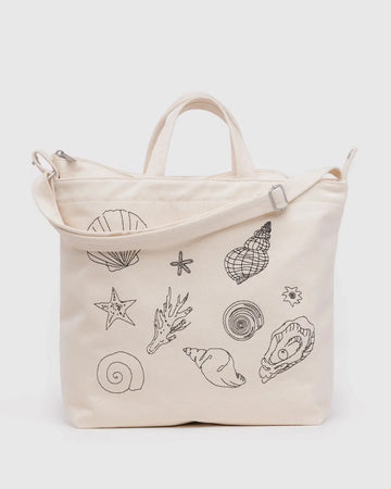 Beige Baggu duck bag with black seashell embroidery on a white background