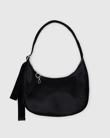 Black leather Baggu crescent bag on a light gray background
