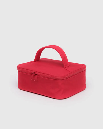 Red rectangular Baggu cosmetic  case with a handle on a light gray background
