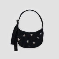 Black Baggu small crescent bag with silver star print that look like large sequins on a light gray background