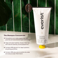 Everist shampoo concentrate tube with product details on a green tiled wall background