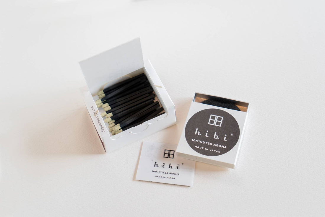 an open box of 30 hibi Japanese Cypress incense matches on a white background