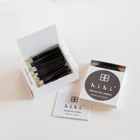 an open box of 30 hibi Japanese Cypress incense matches on a white background