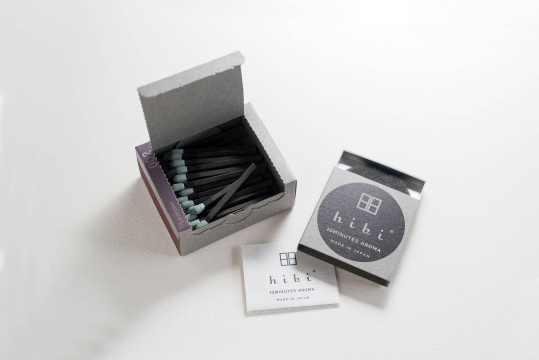 a box of hibi lavender incense matches open on a light grey background 