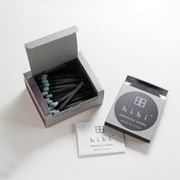 a box of hibi lavender incense matches open on a light grey background 