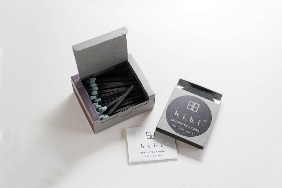 a box of hibi lavender incense matches open on a light grey background 