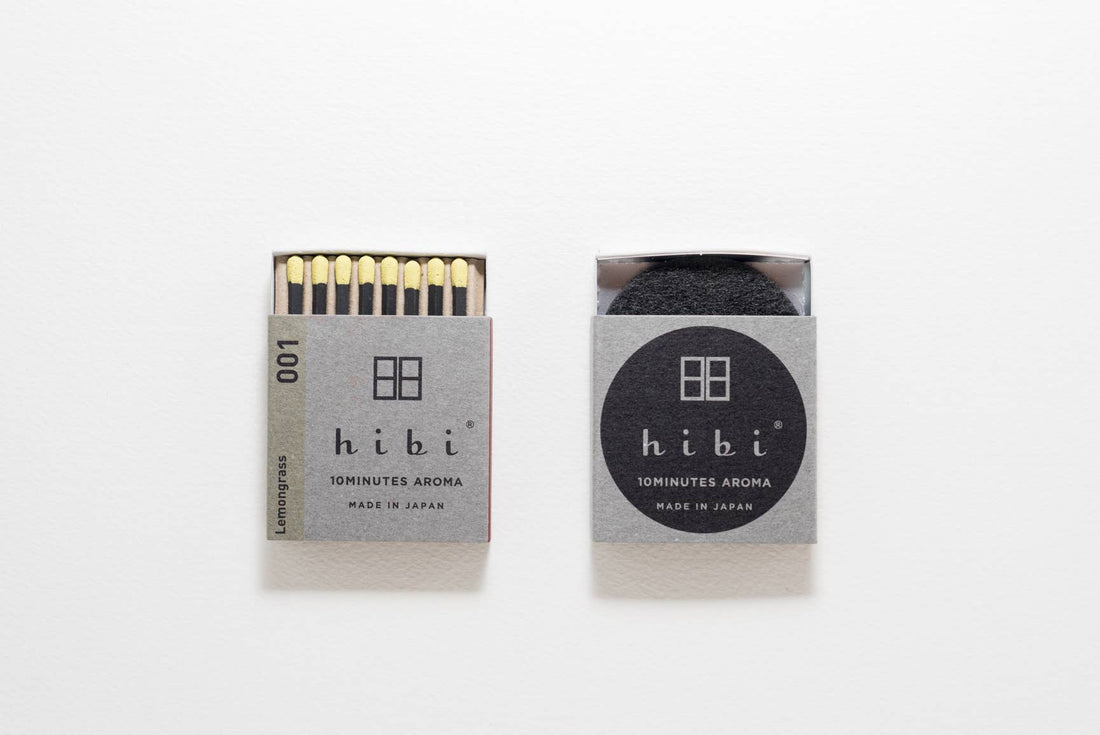 Two open packages of hibi matches on a white background
