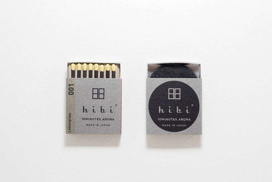 Two open packages of hibi matches on a white background