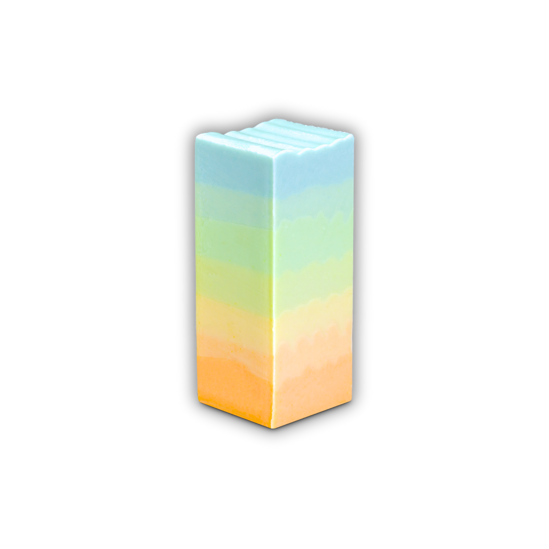 A blue, green, yellow and oragne gradient-colored bar of Soap So Co Horizons mini soap on a white background