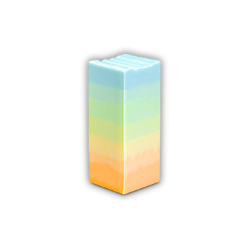 A blue, green, yellow and oragne gradient-colored bar of Soap So Co Horizons mini soap on a white background
