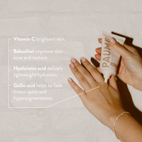 Hand applying skincare product with text about ingredients benefits on a neutral background