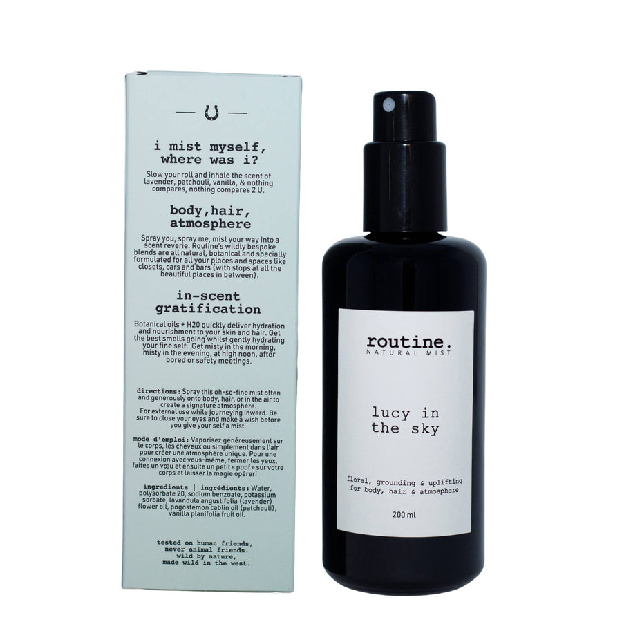 Routine 'Lucy in the Sky' hair, body & atmosphere mist in a dark glass sprayer bottle with white label and outer box back view with ingredients list on a white background