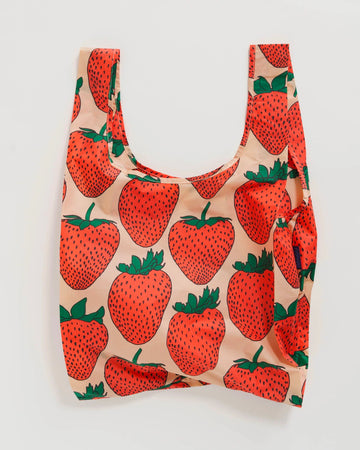 Baggu nylon reusable standard bag with large strawberry print on pink background