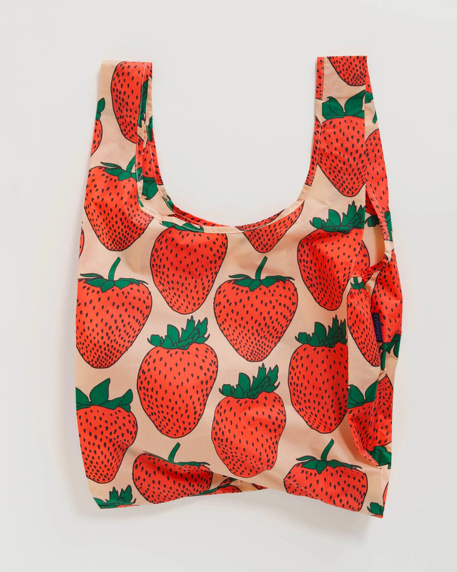 Baggu nylon reusable standard bag with large strawberry print on pink background