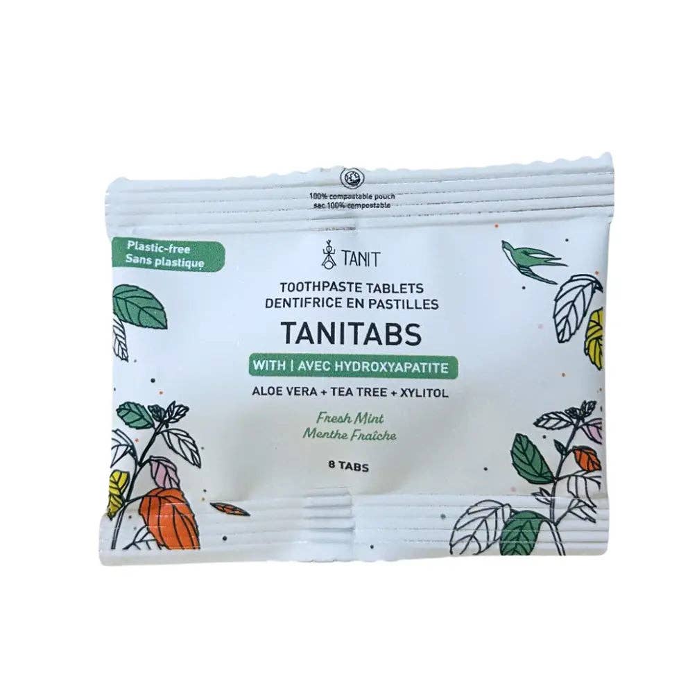 Packaging of TANIT toothpaste tablets with botanical illustrations on a white background
