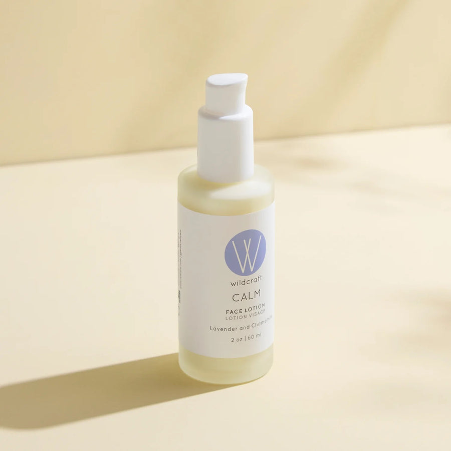 Bottle of Wildcraft Calm Face Lotion on a beige background
