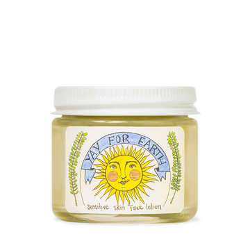Jar of Yay For Earth Sensitive Skin Face Lotion with a smiling sun and blue banner on the label.