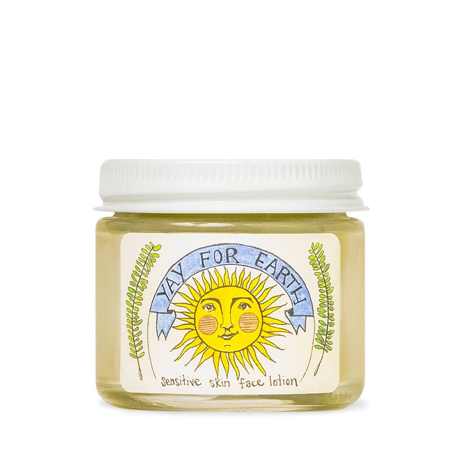 Jar of Yay For Earth Sensitive Skin Face Lotion with a smiling sun and blue banner on the label.